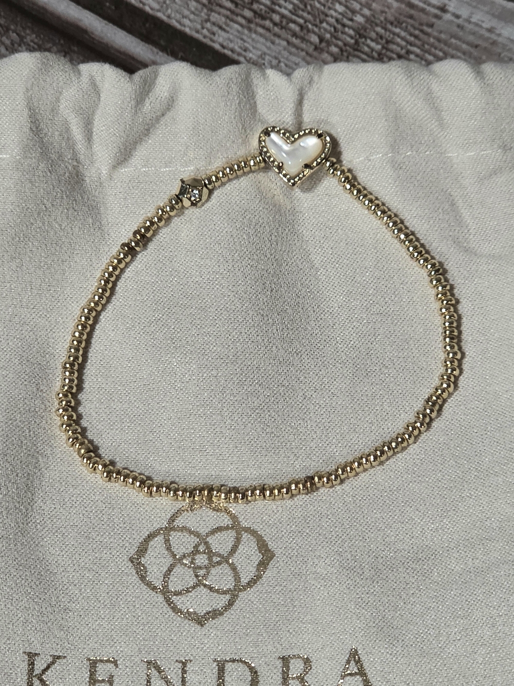 Kendra Scott Gold Ari Stretch Bracelet With Ivory Mother of Pearl Heart Accent - Picture 2 of 7